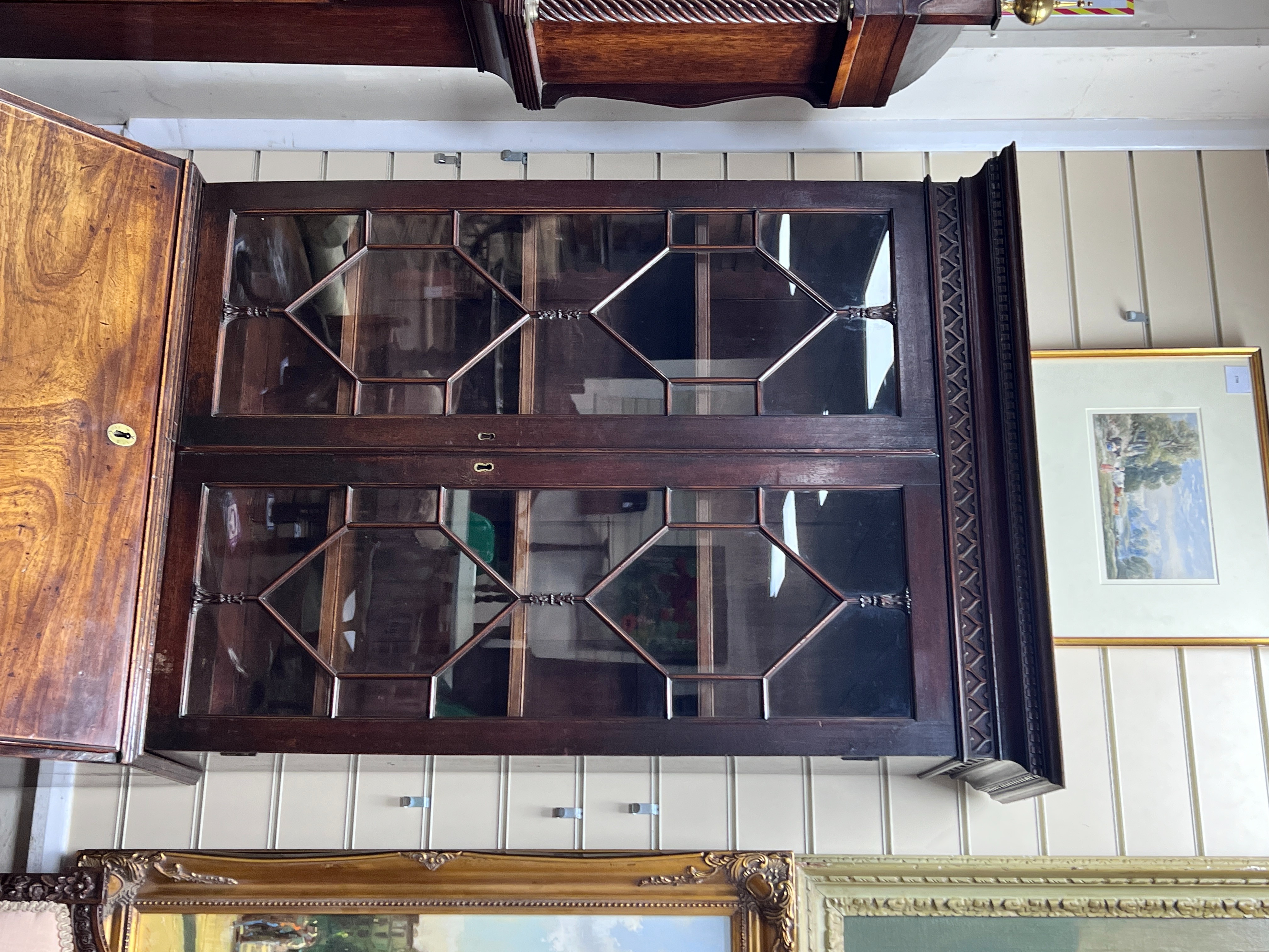A George III mahogany bureau bookcase of narrow proportions with panelled cupboard base, width 77cm, depth 52cm, height 209cm